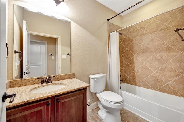 full bathroom featuring vanity, tile patterned flooring, shower / bath combo with shower curtain, toilet, and a textured wall