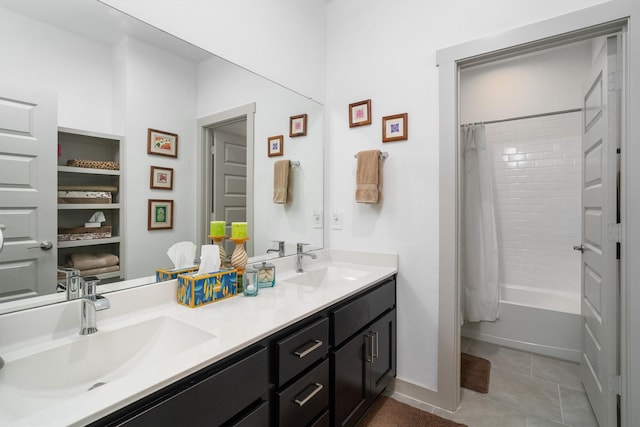 bathroom with a sink, shower / tub combo, double vanity, and tile patterned floors