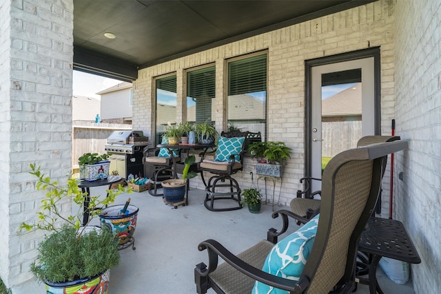 view of patio / terrace featuring area for grilling and fence