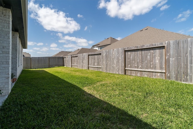 view of yard featuring a fenced backyard