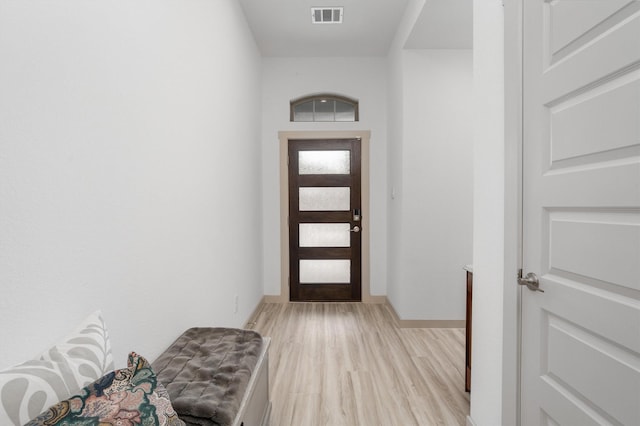 entrance foyer featuring light wood-style flooring, baseboards, and visible vents