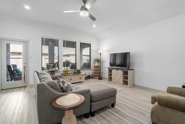 living area with recessed lighting, light wood finished floors, baseboards, ceiling fan, and vaulted ceiling