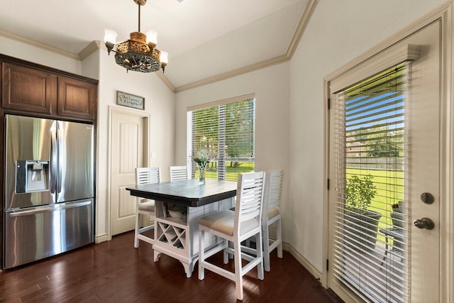 dining space featuring dark wood-style floors, baseboards, an inviting chandelier, lofted ceiling, and ornamental molding