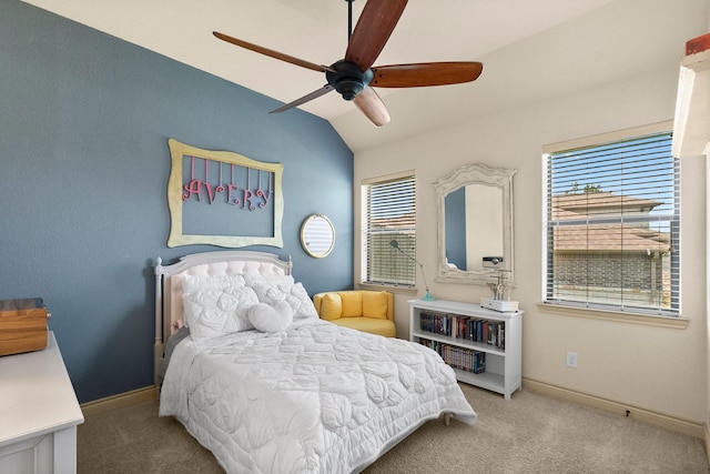 carpeted bedroom featuring ceiling fan, baseboards, and vaulted ceiling