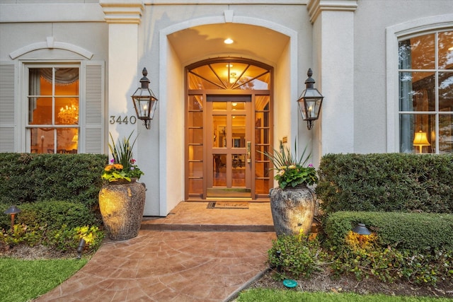 property entrance featuring stucco siding