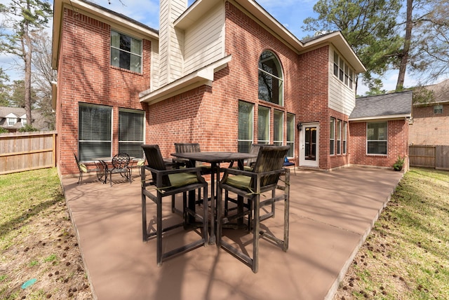 view of patio / terrace featuring outdoor dining area and fence