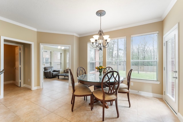 dining space with light tile patterned floors, a healthy amount of sunlight, and ornamental molding