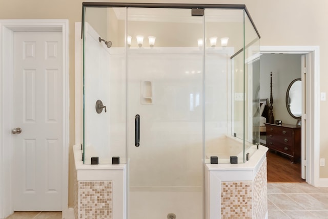 bathroom with tile patterned floors and a shower stall