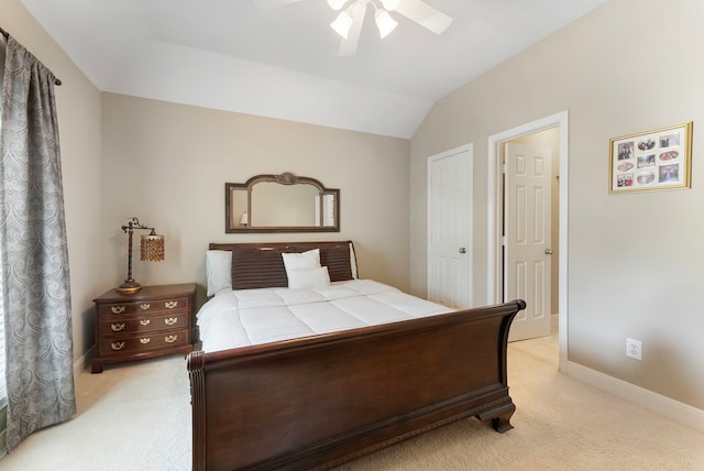 bedroom featuring a ceiling fan, lofted ceiling, light colored carpet, and baseboards