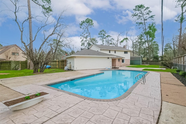 view of pool with a yard, a fenced in pool, a fenced backyard, and a patio area