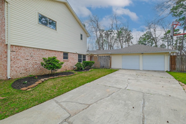 view of front of house featuring fence, driveway, a front lawn, a garage, and brick siding