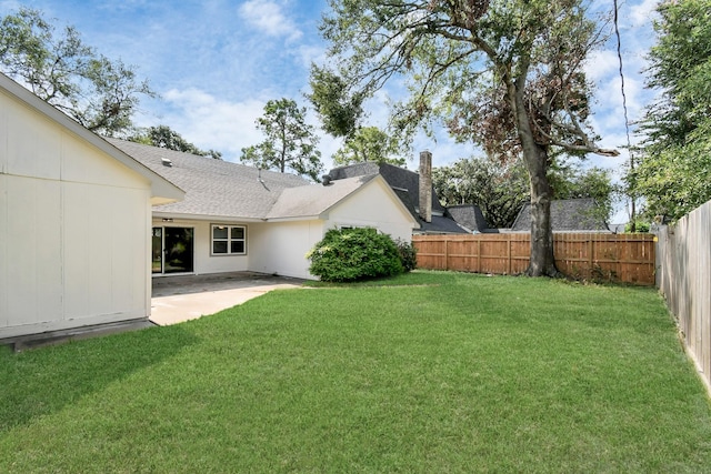 view of yard with a fenced backyard and a patio area