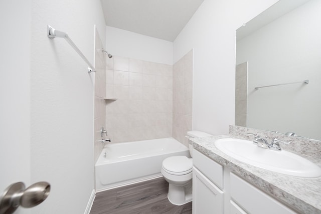 16527 Willow Forest Dr, Conroe, TX 77302 - full bath featuring wood finished floors, toilet, vanity, and  shower combination