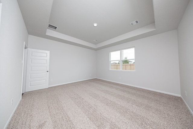 16527 Willow Forest Dr, Conroe, TX 77302 - carpeted empty room featuring a tray ceiling and baseboards