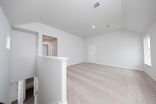 16527 Willow Forest Dr, Conroe, TX 77302 - empty room with lofted ceiling, carpet flooring, and baseboards