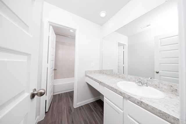 16527 Willow Forest Dr, Conroe, TX 77302 - full bath with vanity, wood finished floors, and baseboards