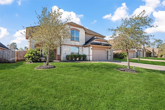 view of front of property with a front lawn, concrete driveway, fence, and brick siding