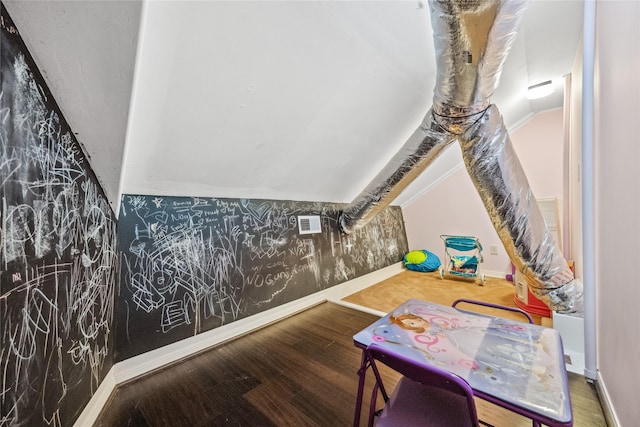 interior space with visible vents, wood finished floors, and baseboards