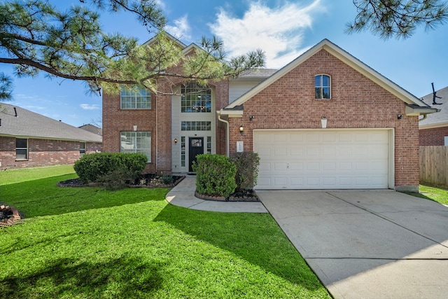 traditional-style house with brick siding, driveway, an attached garage, and a front yard