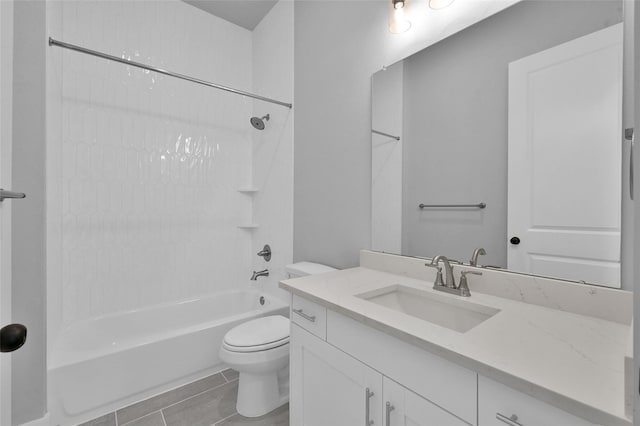 full bath with tile patterned floors, vanity, toilet, and shower / tub combination