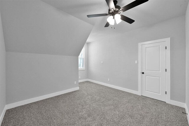 bonus room with baseboards, a ceiling fan, lofted ceiling, and carpet floors