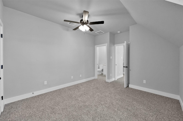 unfurnished bedroom with a ceiling fan, carpet, visible vents, baseboards, and ensuite bath