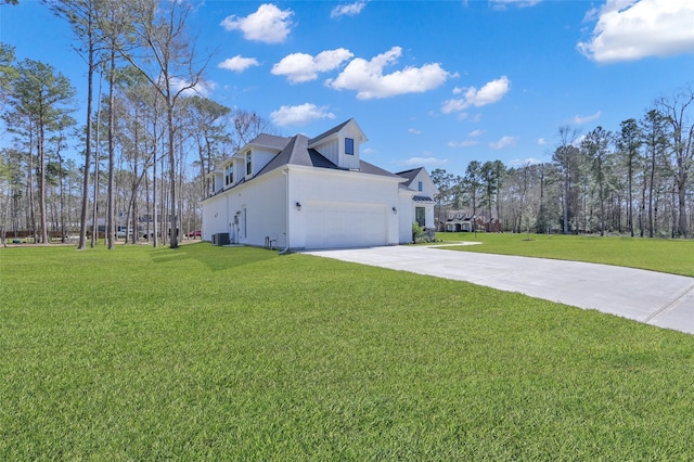 view of home's exterior with central air condition unit, a lawn, concrete driveway, and an attached garage