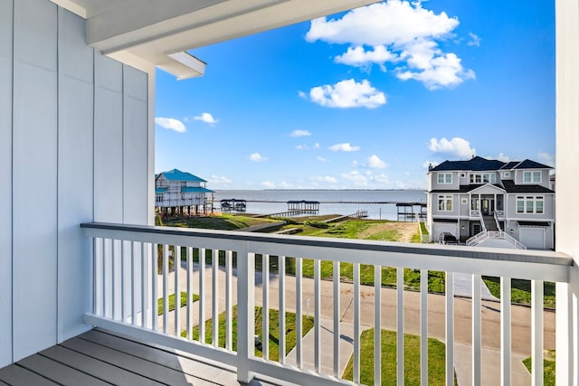 balcony featuring a water view