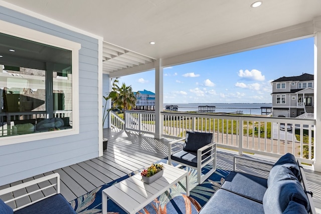 deck with a water view and an outdoor hangout area