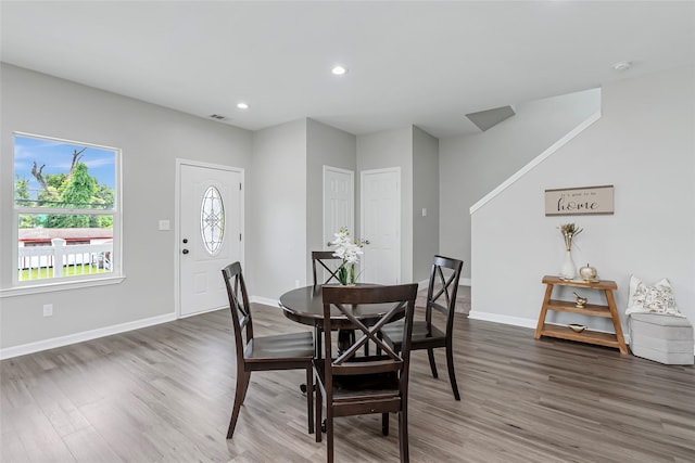 dining area featuring recessed lighting, baseboards, and wood finished floors