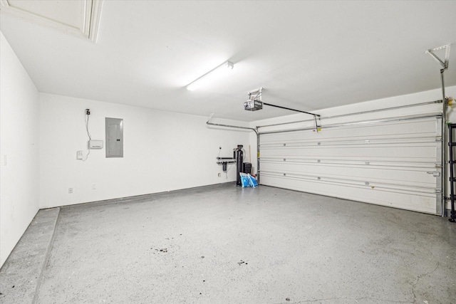 garage featuring electric panel and a garage door opener