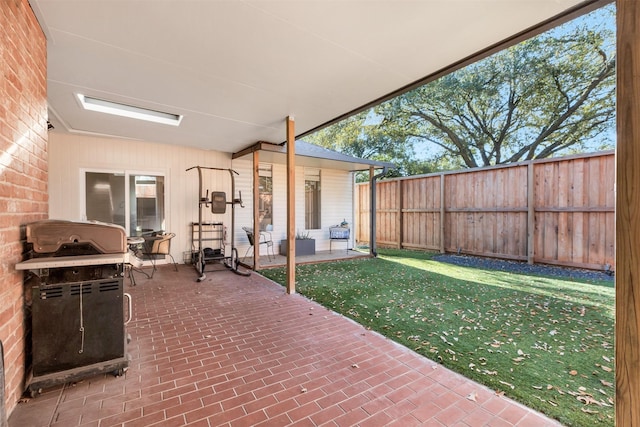 view of patio / terrace featuring area for grilling and fence