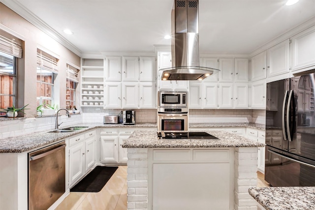 kitchen featuring black appliances, island exhaust hood, a sink, backsplash, and white cabinetry