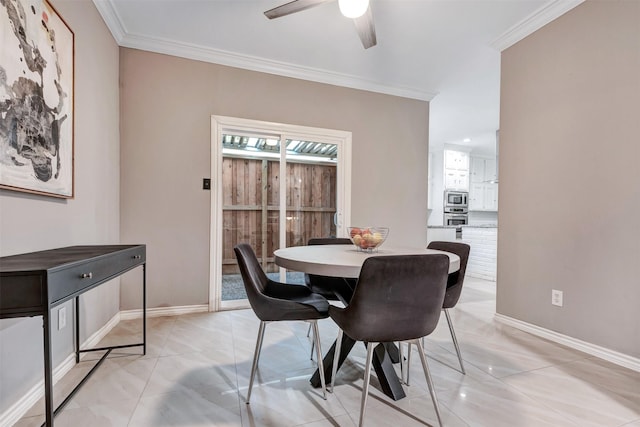 dining room with light tile patterned floors, crown molding, and baseboards