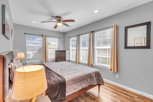 bedroom featuring recessed lighting, a ceiling fan, baseboards, and wood finished floors