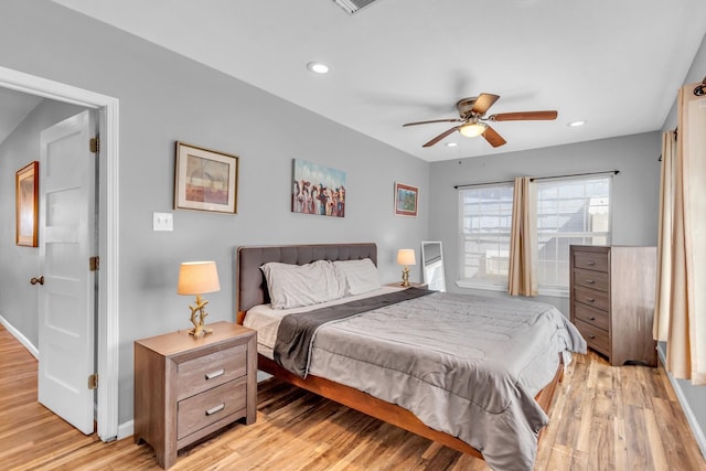 bedroom featuring recessed lighting, light wood-style floors, and baseboards