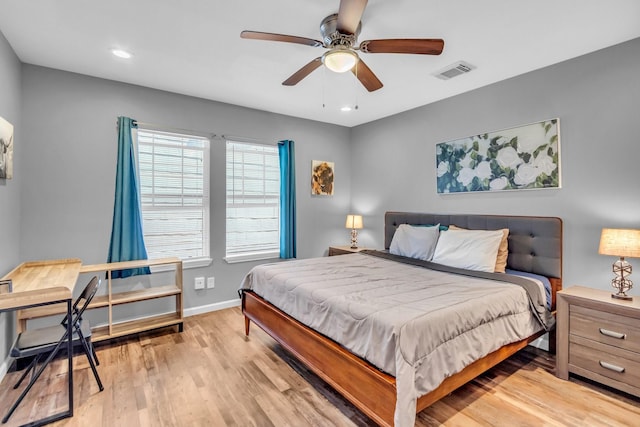 bedroom featuring visible vents, light wood-style flooring, recessed lighting, baseboards, and ceiling fan