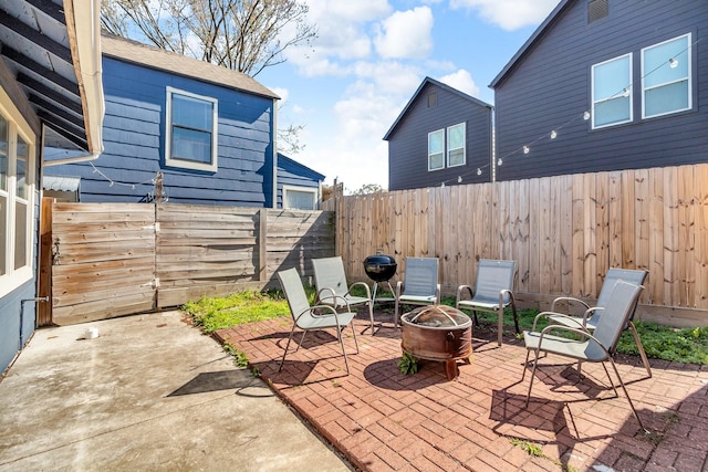 view of patio / terrace featuring a fenced backyard and an outdoor fire pit