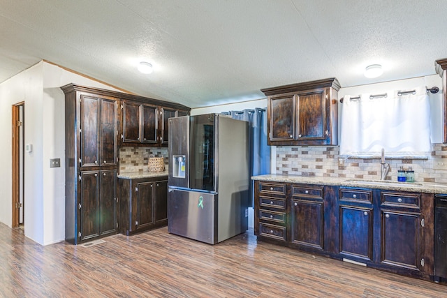 kitchen with dark wood-type flooring, smart refrigerator, dark brown cabinetry, and a sink