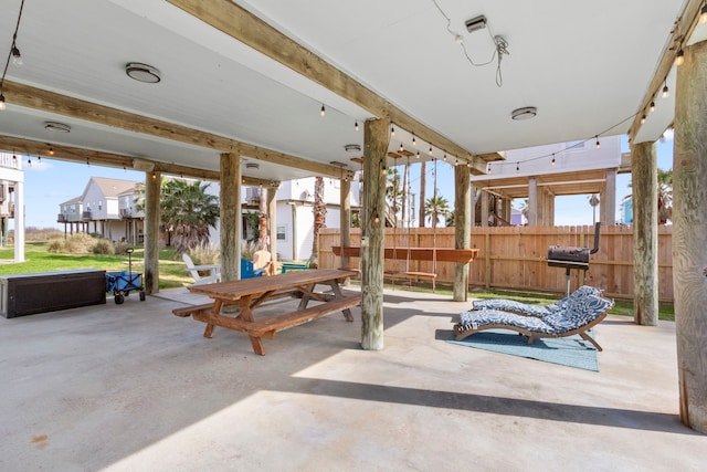 view of patio / terrace featuring fence