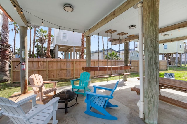 view of patio / terrace featuring fence and an outdoor fire pit