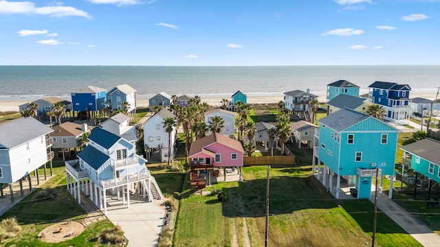 drone / aerial view with a residential view and a water view