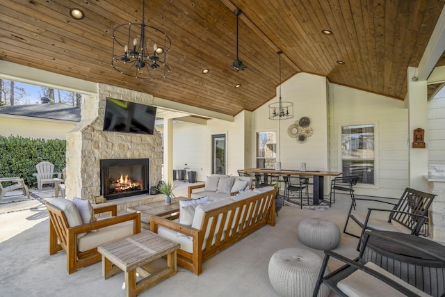 view of patio / terrace featuring a ceiling fan and an outdoor living space with a fireplace