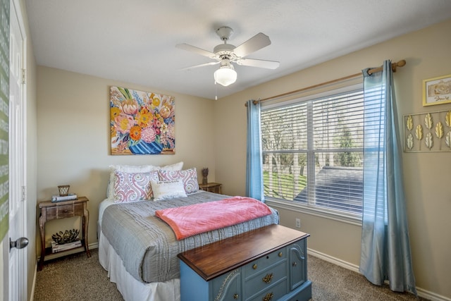 bedroom featuring baseboards, a ceiling fan, and dark carpet