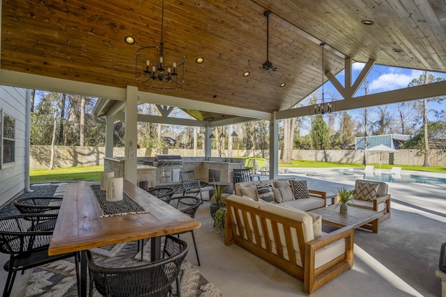 view of patio with area for grilling, a fenced backyard, a grill, outdoor dining area, and a fenced in pool