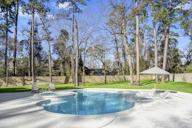 view of pool featuring a yard, a patio, a pool with connected hot tub, and a fenced backyard