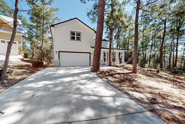 view of front of house with a garage and driveway