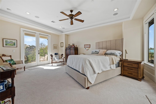 bedroom featuring ceiling fan, recessed lighting, a raised ceiling, light colored carpet, and access to exterior