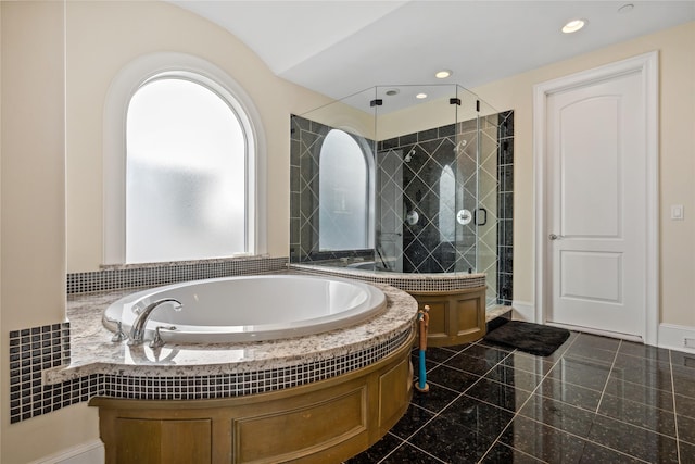 full bathroom featuring granite finish floor, recessed lighting, a shower stall, baseboards, and a bath