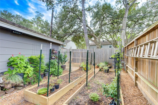 view of yard featuring a garden and fence